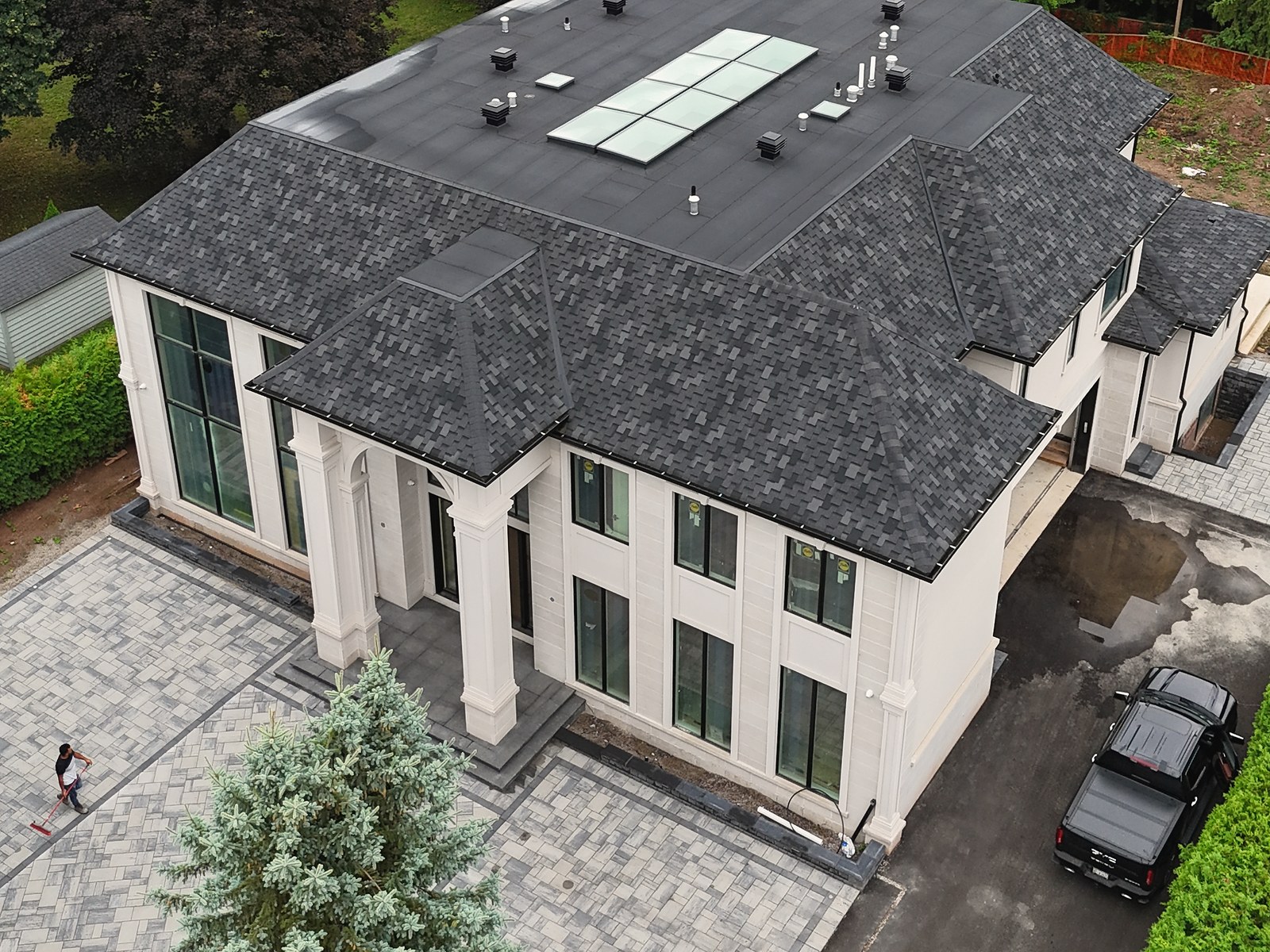 Aerial site overview showing a completed front entrance and interlocking area